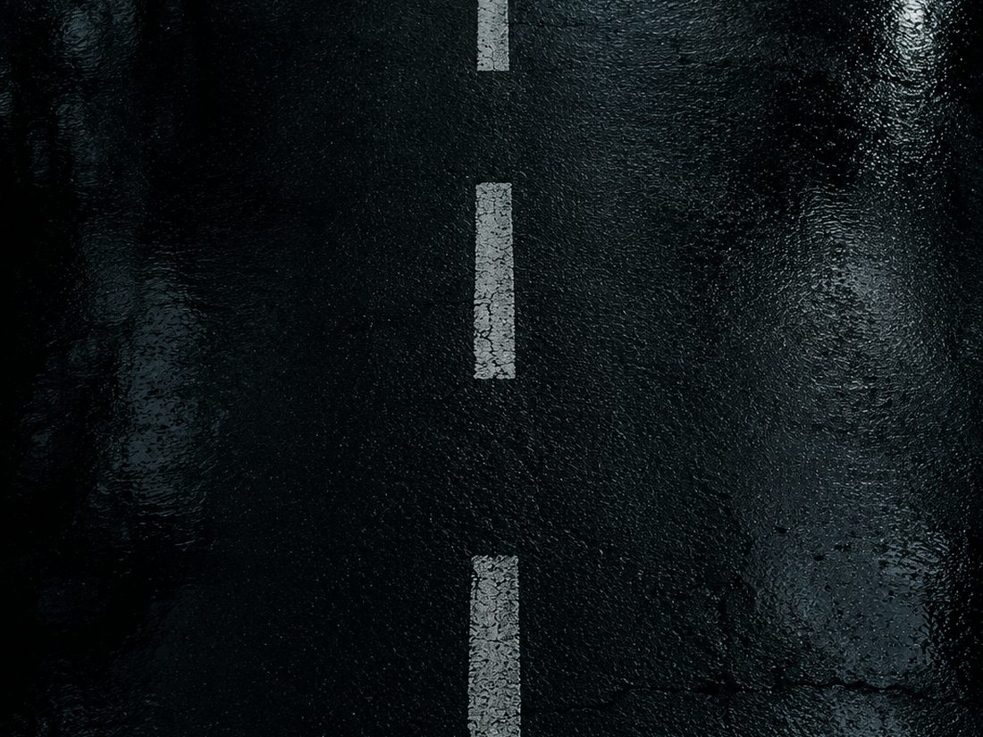 Lane markings on wet asphalt